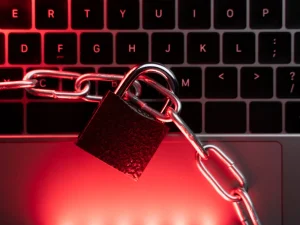 A chain with lock above laptop keyboard